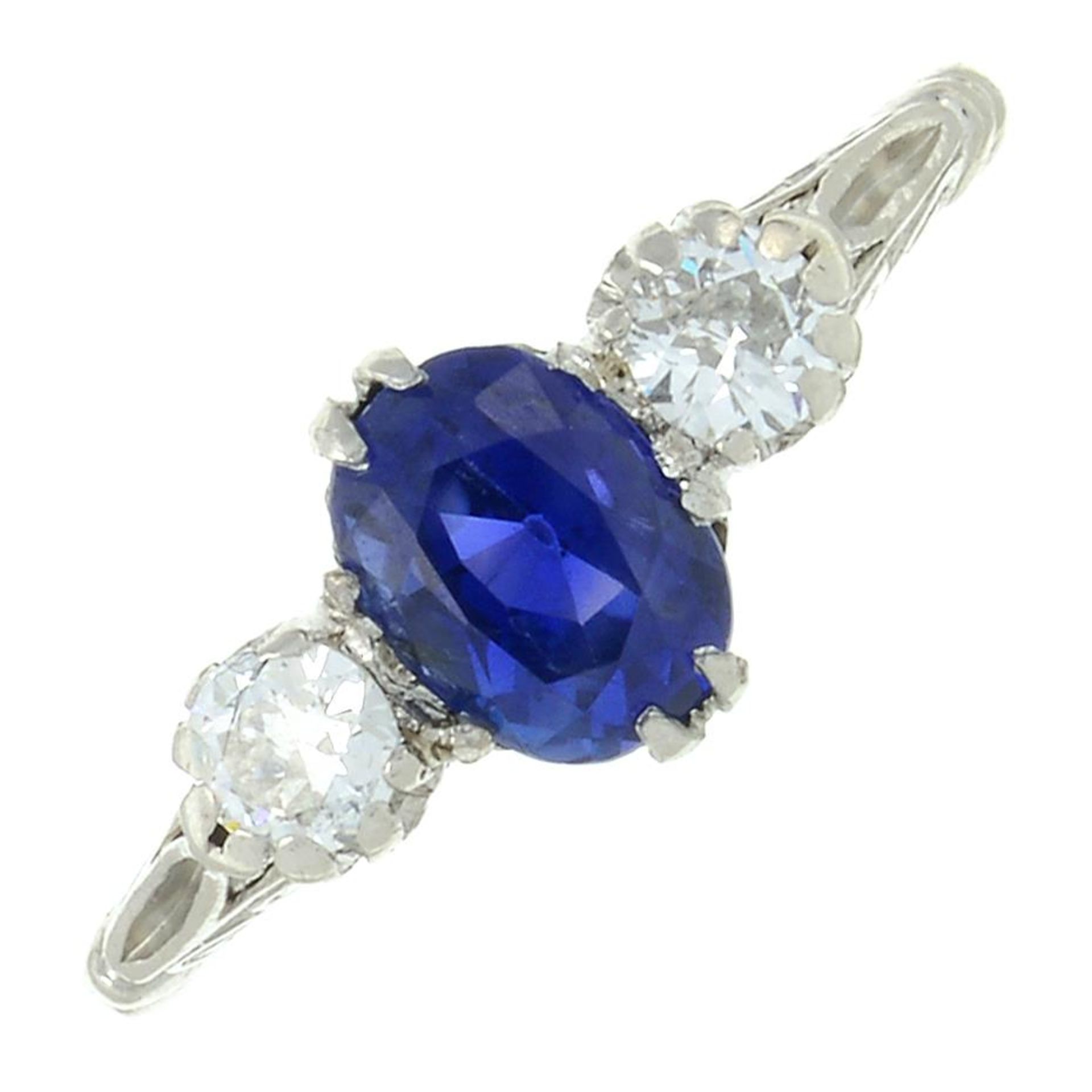 A No-heat Ceylon sapphire and brilliant-cut diamond three-stone ring.Sapphire calculated weight