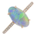 A boulder opal cabochon and brilliant-cut diamond ring.Opal weight 2.19cts stamped to band.