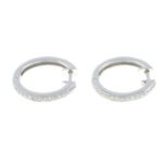 A pair of 18ct gold brilliant-cut diamond hoop earrings.Estimated total diamond weight