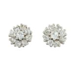 A pair of old-cut diamond cluster earrings.