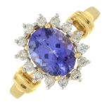 An 18ct gold tanzanite and brilliant-cut diamond cluster ring.