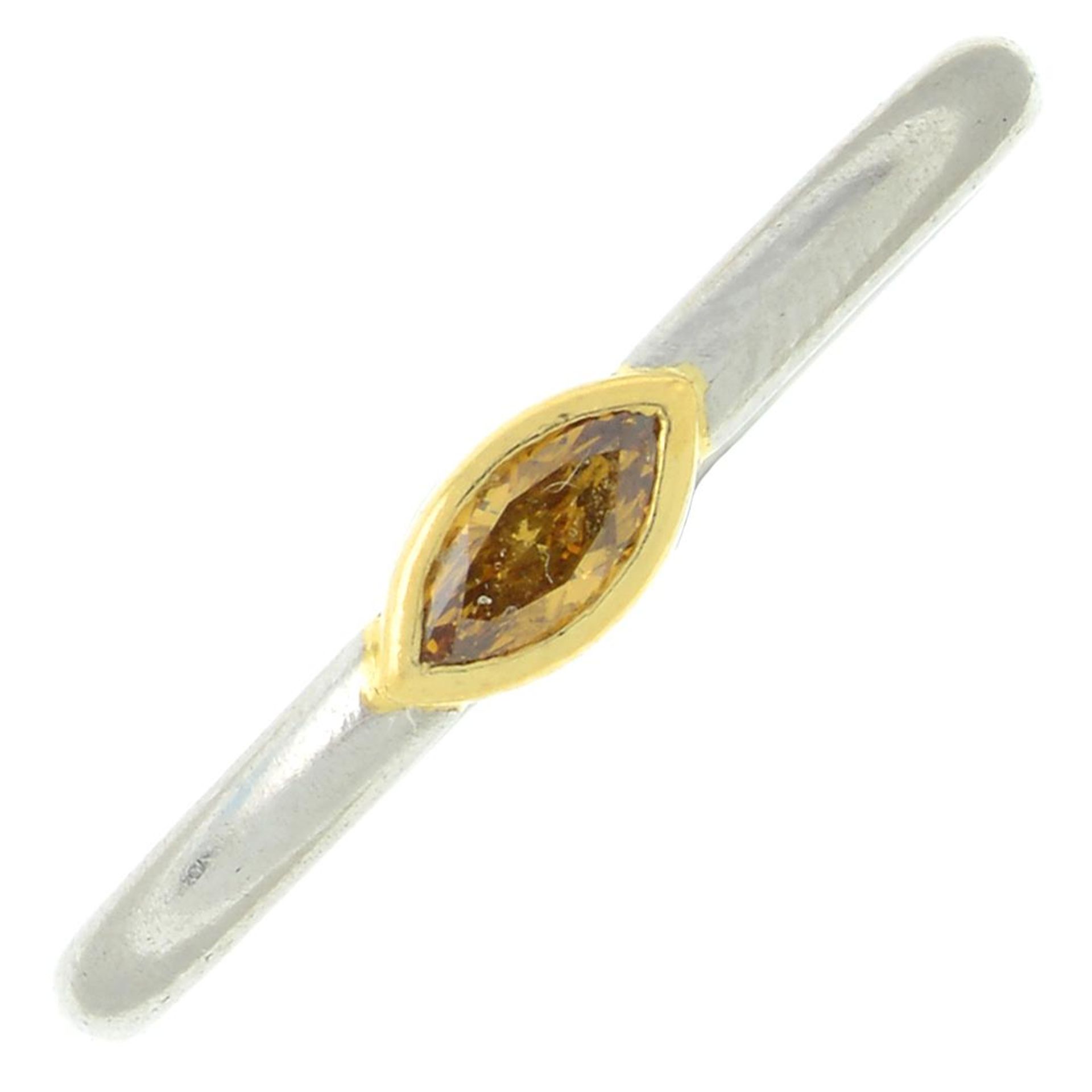 A marquise-shape 'orange' diamond single-stone ring.Estimated diamond weight 0.15ct,