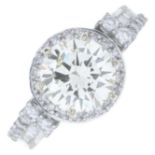 A brilliant-cut diamond single-stone ring, with vari-cut diamond surround and shoulders.