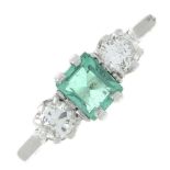 An emerald and brilliant-cut diamond three-stone ring.Emerald calculated weight 0.47ct,