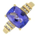 A 14ct tanzanite and colourless sapphire dress ring.Tanzanite calculated weight 2.98cts,