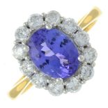 An 18ct gold tanzanite and brilliant-cut diamond cluster ring.Tanzanite weight 1.96cts.Total