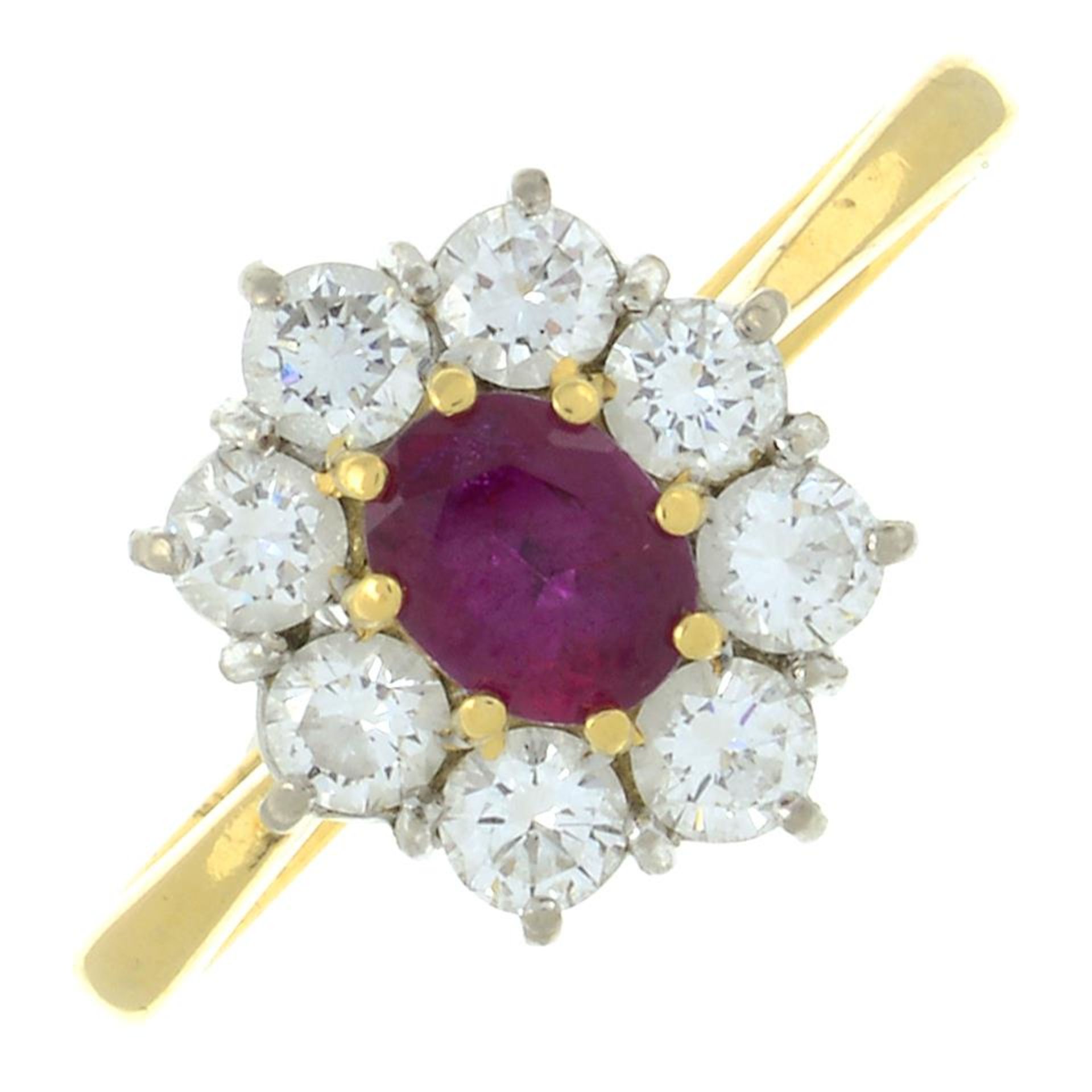 An 18ct gold ruby and brilliant-cut diamond cluster ring.Ruby calculated weight 0.61ct,
