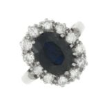 A sapphire and brilliant-cut diamond cluster ring.Estimated total diamond weight 0.80ct,