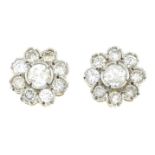 A pair of brilliant-cut diamond cluster earrings.Estimated total diamond weight 0.70ct,