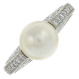 A pearl single-stone ring, with pavé-set diamond shoulders.