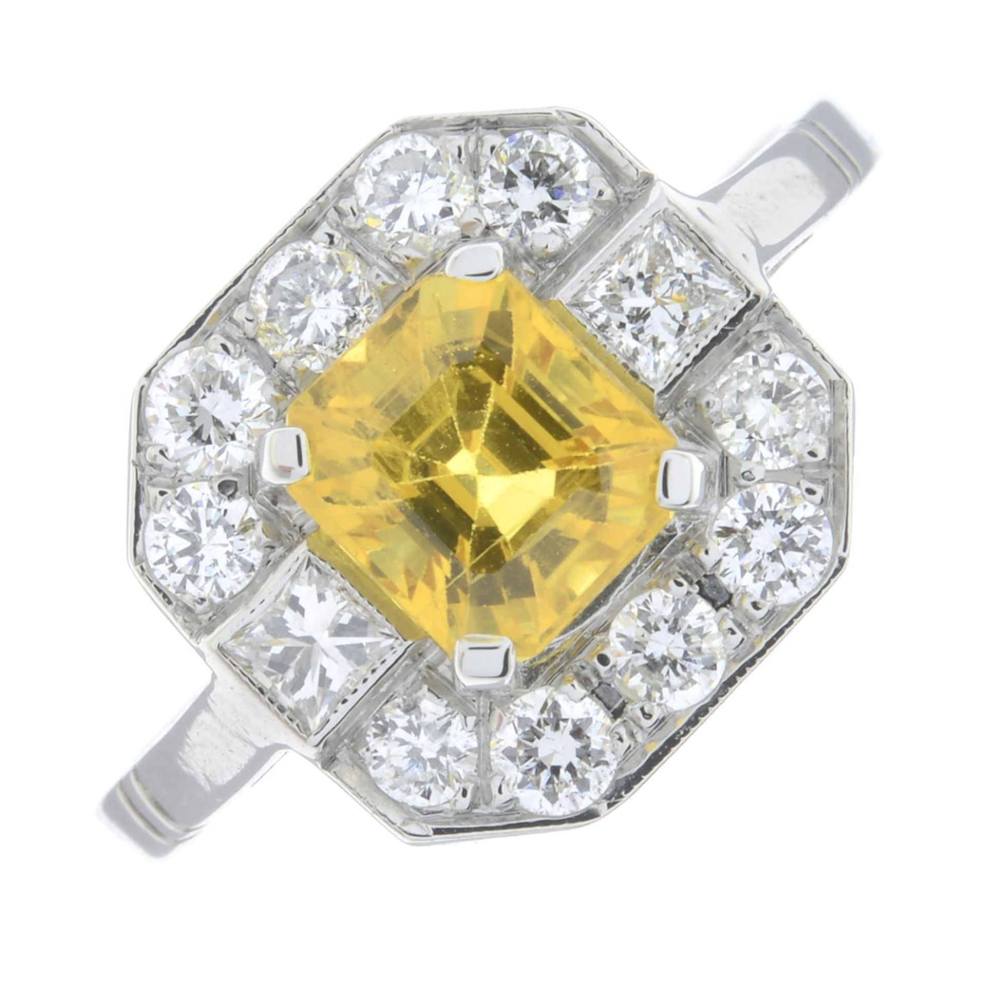 A yellow sapphire and vari-cut diamond cluster ring.Yellow sapphire weight 1.70cts.Total diamond