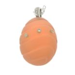 A frosted light pink egg pendant,