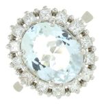 An aquamarine and square-shape diamond cluster ring.Aquamarine calculated weight 2.91cts,