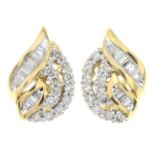 A pair of vari-hue diamond earrings.Estimated total diamond weight 1ct,