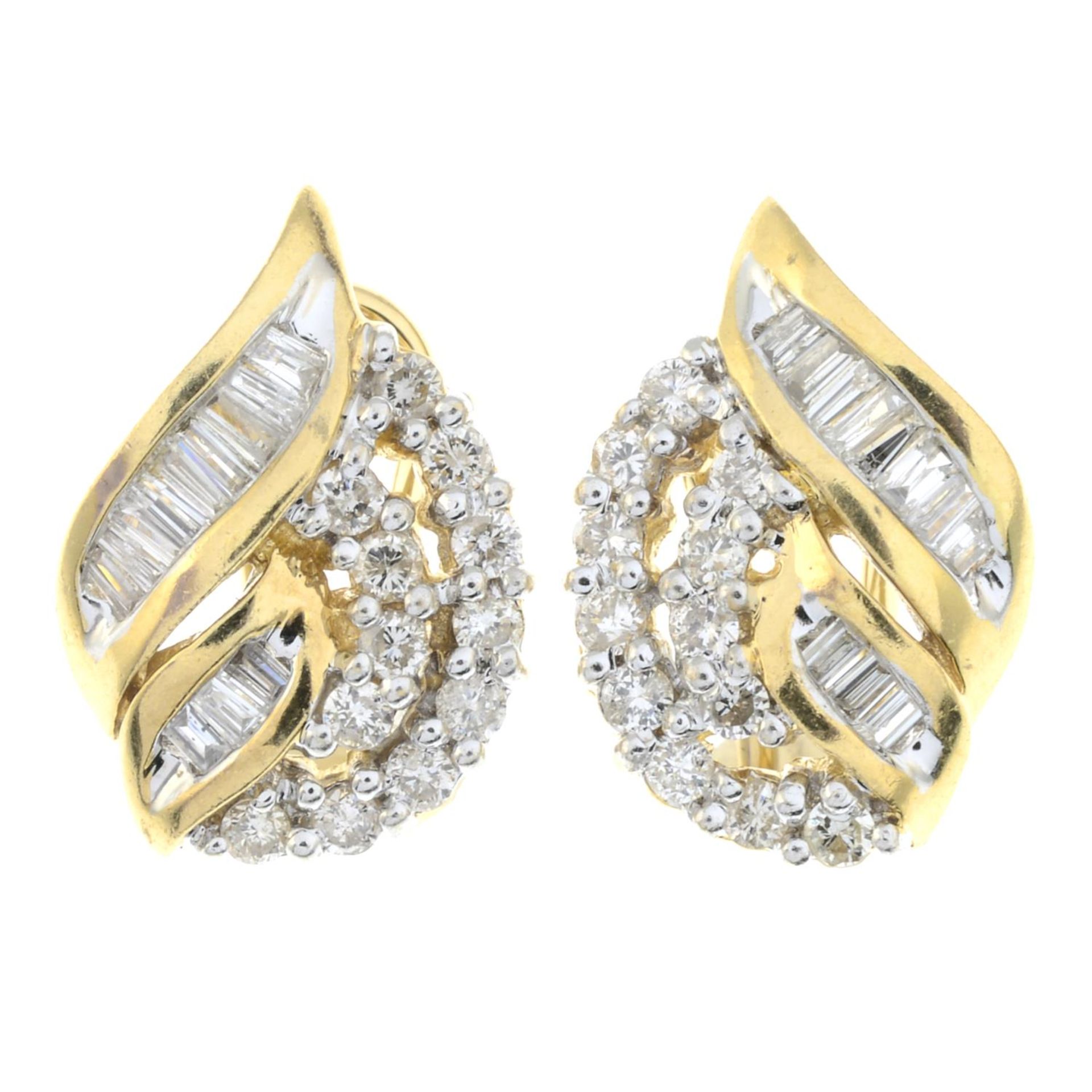 A pair of vari-hue diamond earrings.Estimated total diamond weight 1ct,