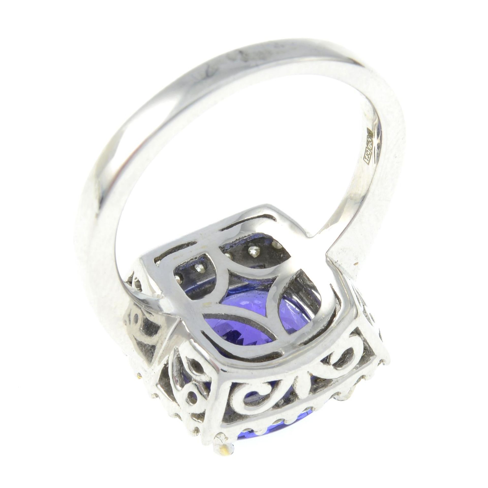 An 18ct gold tanzanite and brilliant-cut diamond cluster ring.Tanzanite calculated weight 5.92cts, - Image 3 of 3