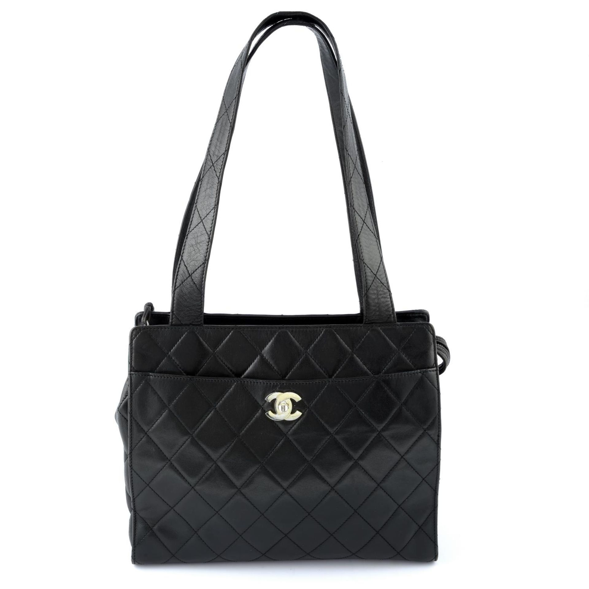 CHANEL - a black quilted leather zip handbag.