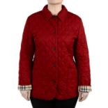 BURBERRY - a red quilted jacket.