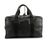 PRADA - a black leather holdall luggage bag.