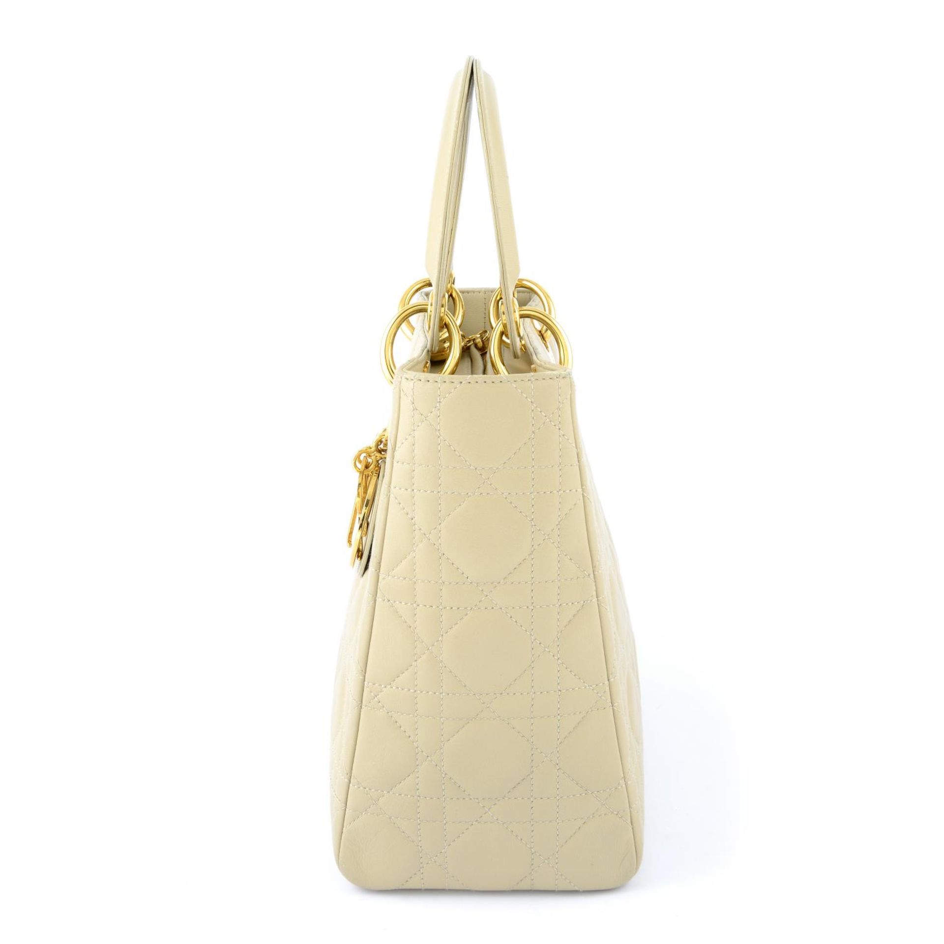 CHRISTIAN DIOR - a beige cannage leather Lady Dior handbag. - Image 4 of 5