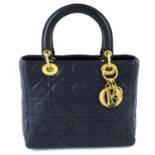 CHRSITIAN DIOR - a navy leather soft body Lady Dior handbag.