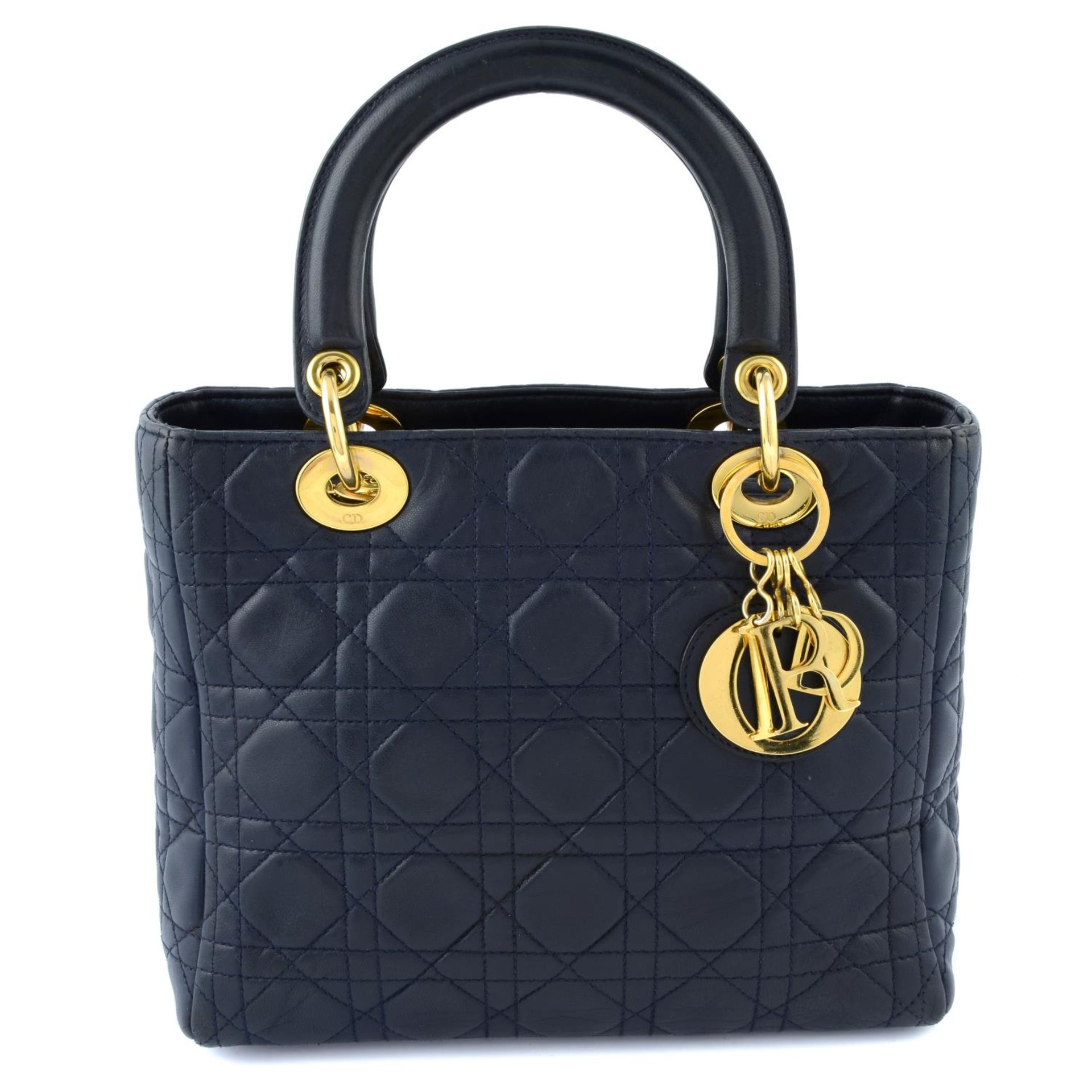 CHRSITIAN DIOR - a navy leather soft body Lady Dior handbag.