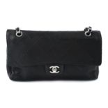 CHANEL - a maxi single flap handbag.