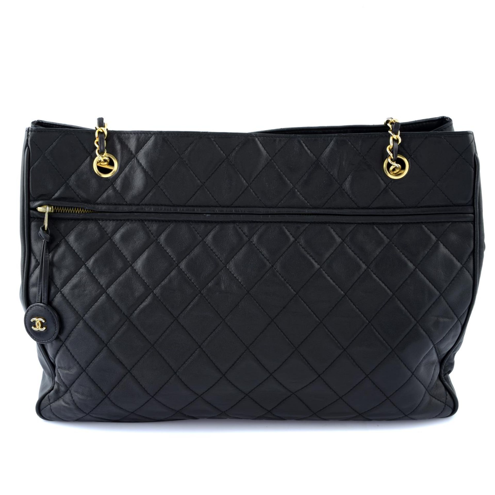 CHANEL - a quilted tote handbag.