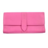 SMYTHSON - a pink leather jewellery roll.
