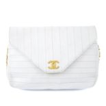 CHANEL - a vintage white single flap handbag.
