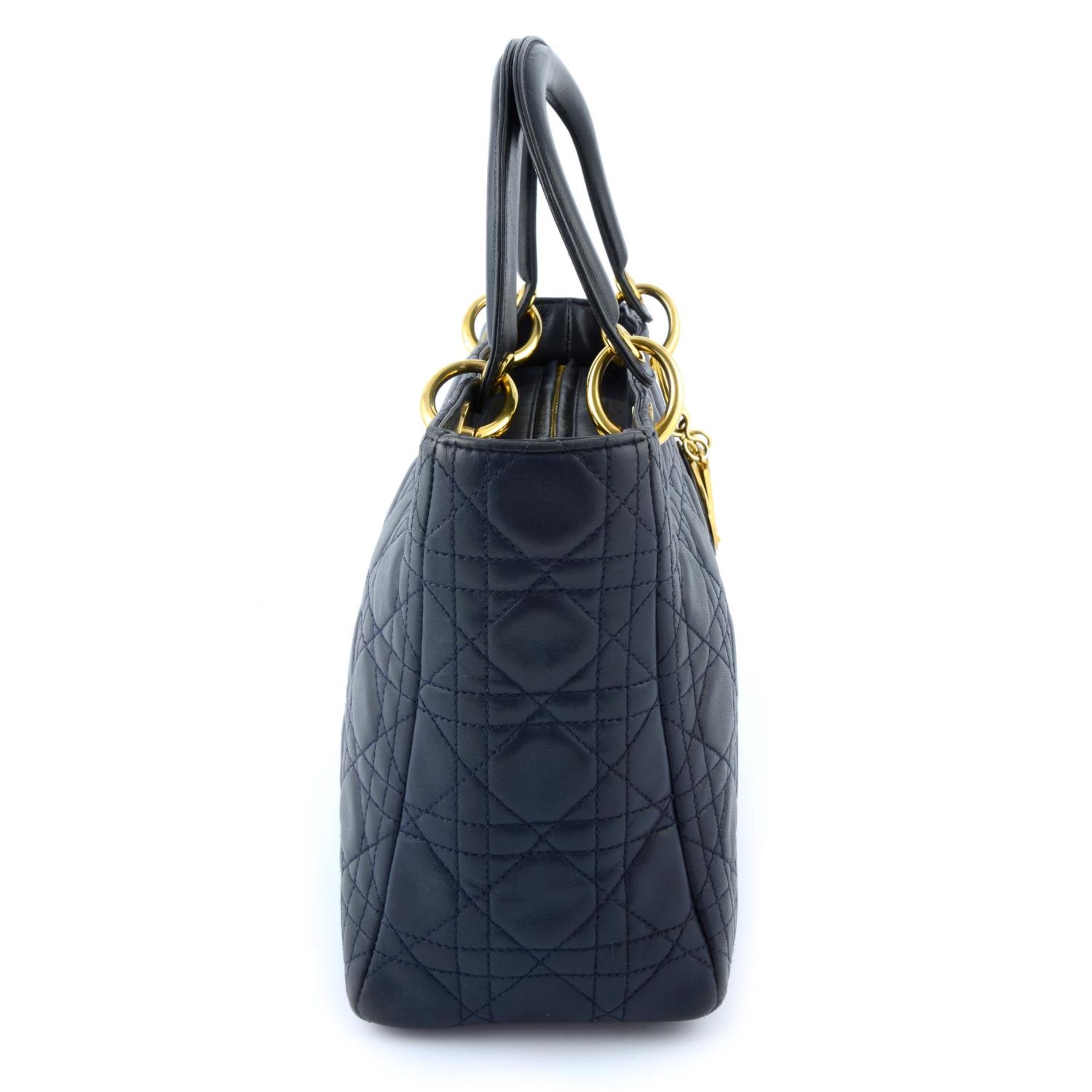 CHRSITIAN DIOR - a navy leather soft body Lady Dior handbag. - Image 4 of 5