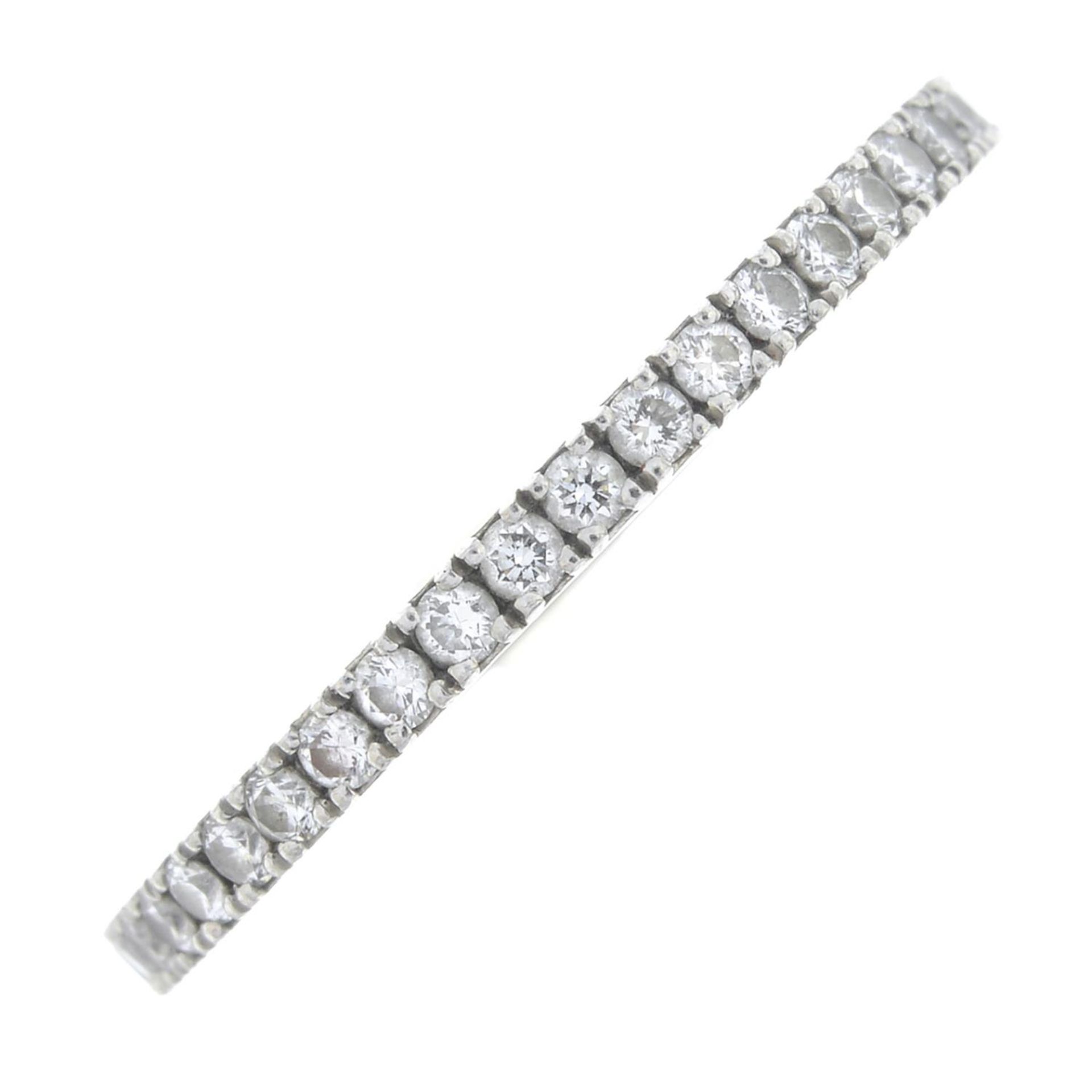 DE BEERS - a platinum brilliant-cut diamond 'DB Classic' half eternity ring.