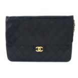 CHANEL - a vintage black single flap handbag.