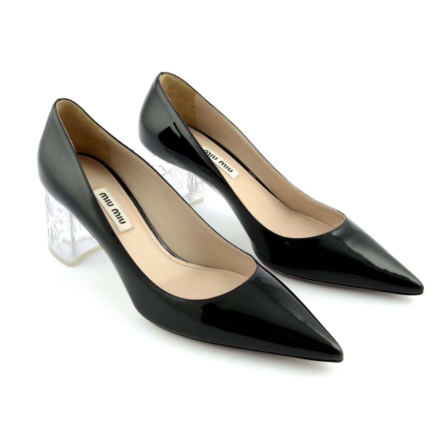 MIU MIU - a pair of black patent leather heeled pumps.