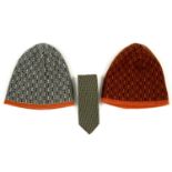 HERMÈS - a silk tie and two wool beanie hats.