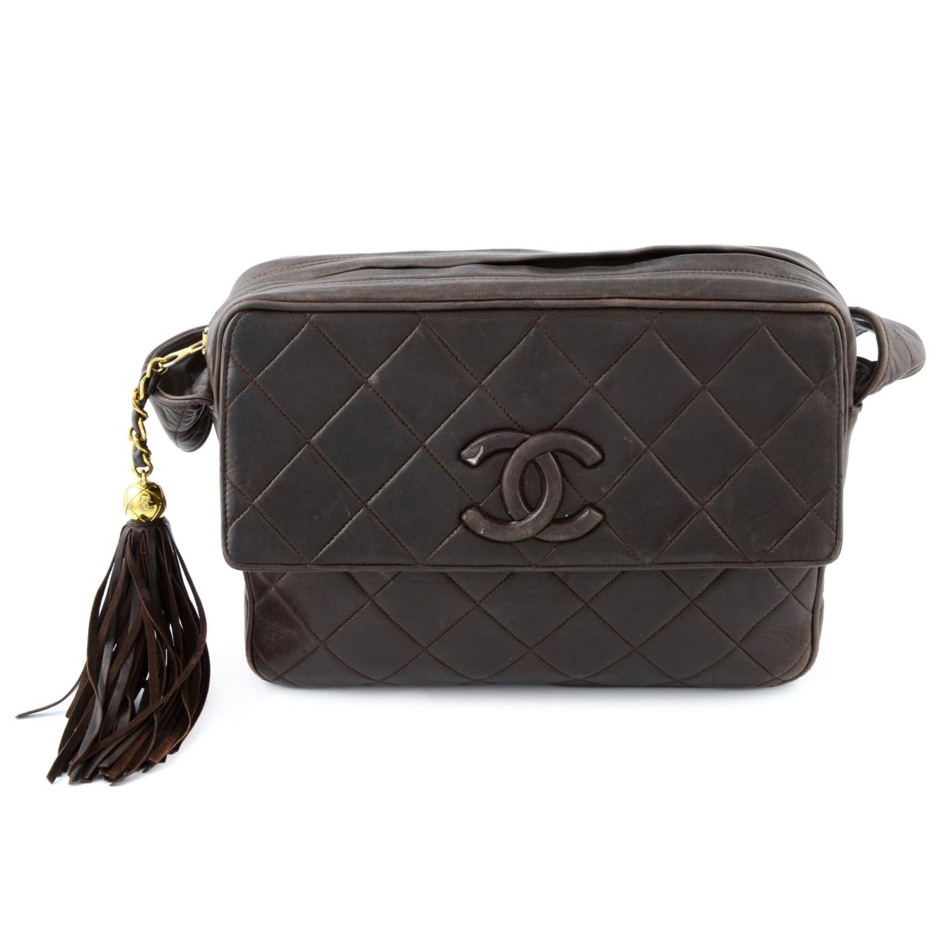 CHANEL - a brown diamond quilted crossbody handbag.