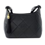 CHANEL - a black diamond quilted leather handbag.