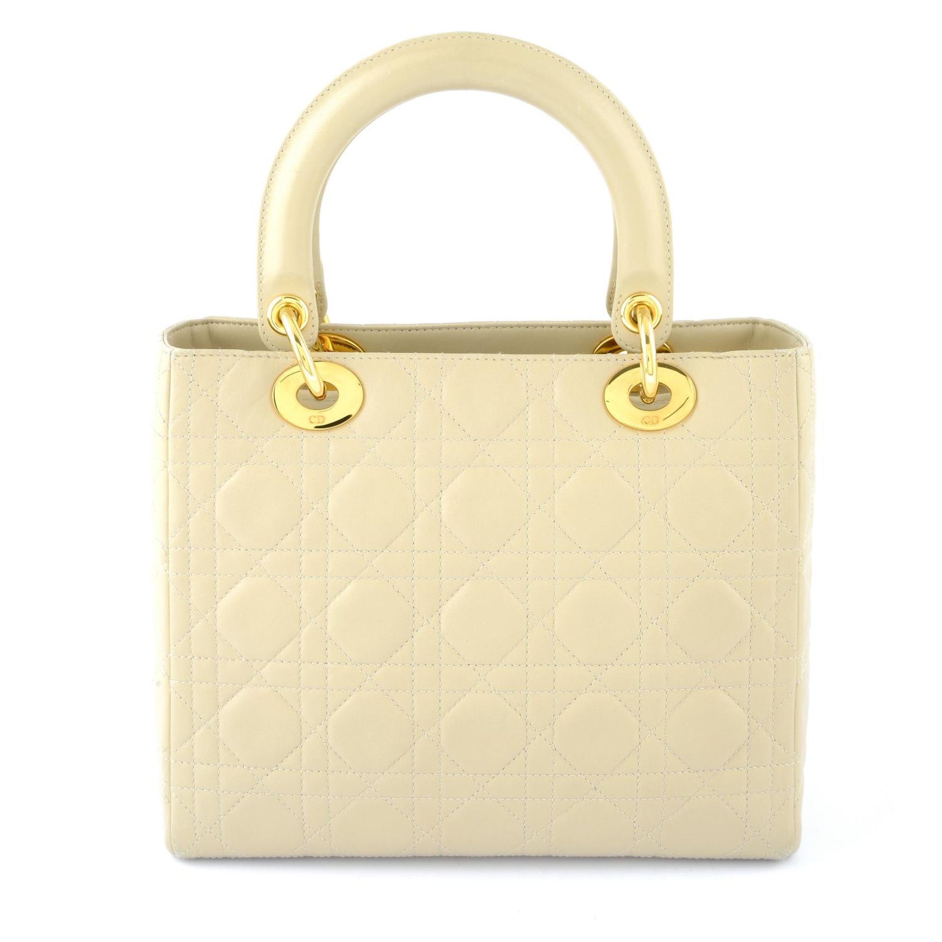 CHRISTIAN DIOR - a beige cannage leather Lady Dior handbag. - Image 2 of 5