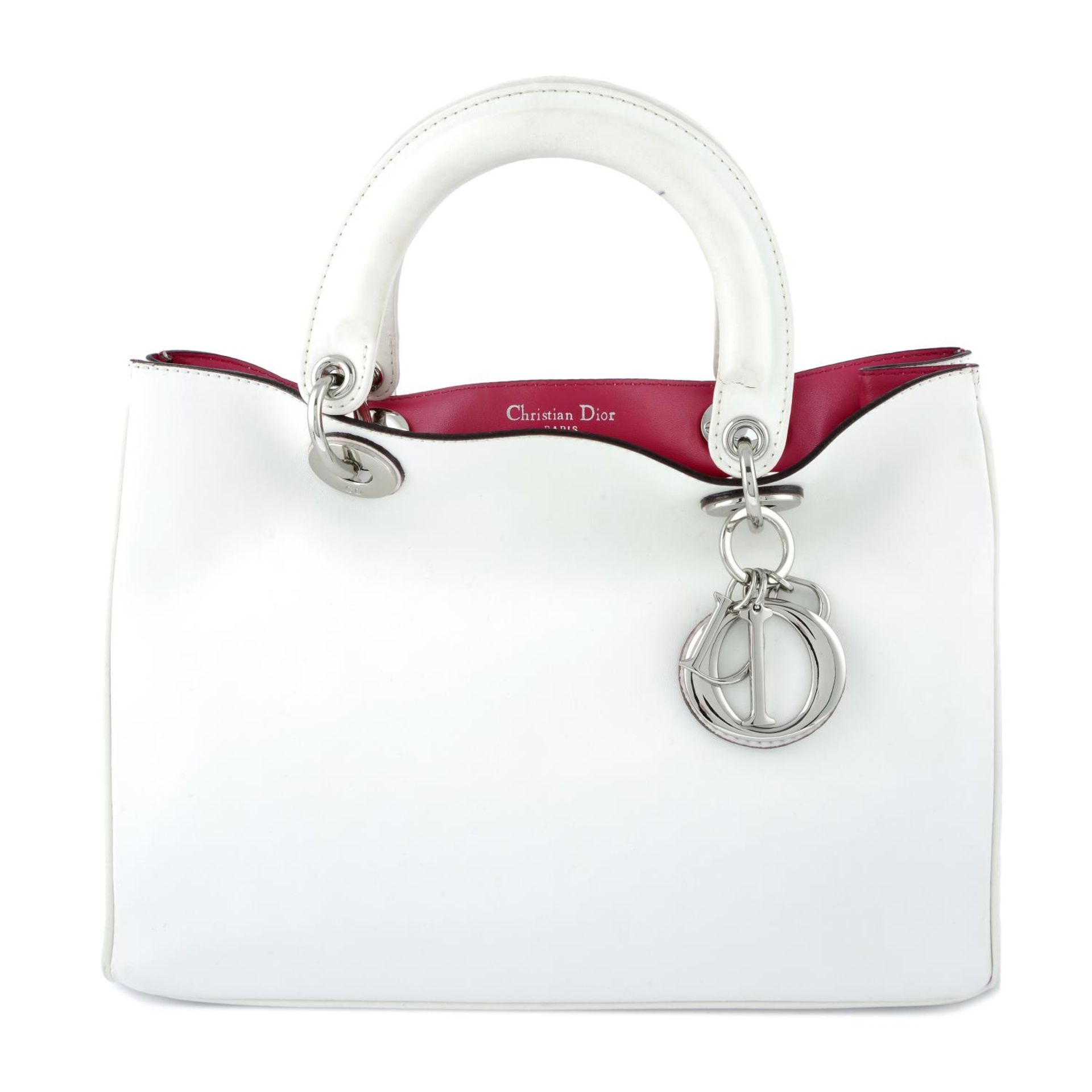 CHRISTIAN DIOR - a white leather Diorissimo handbag.