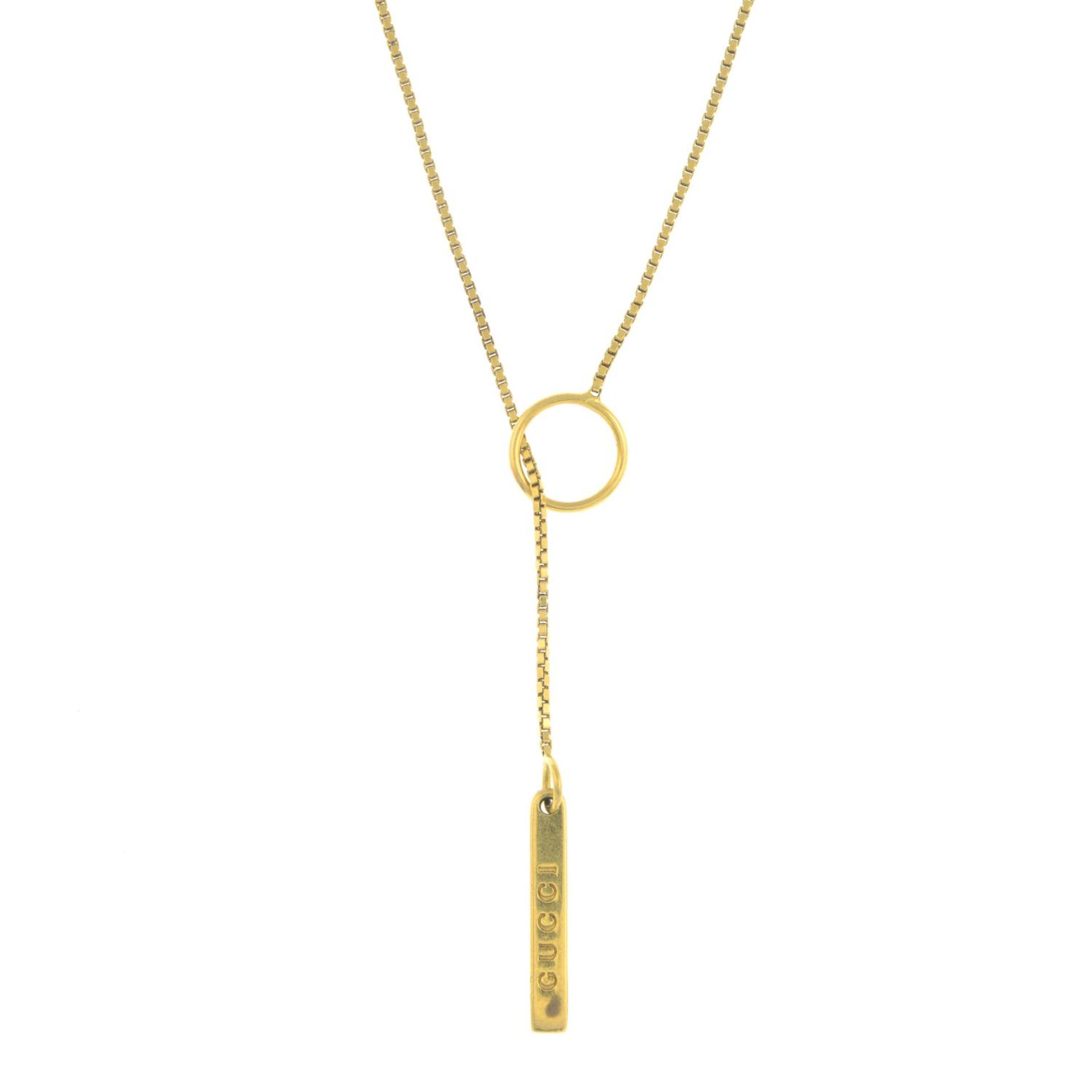 GUCCI - a lariat necklace.