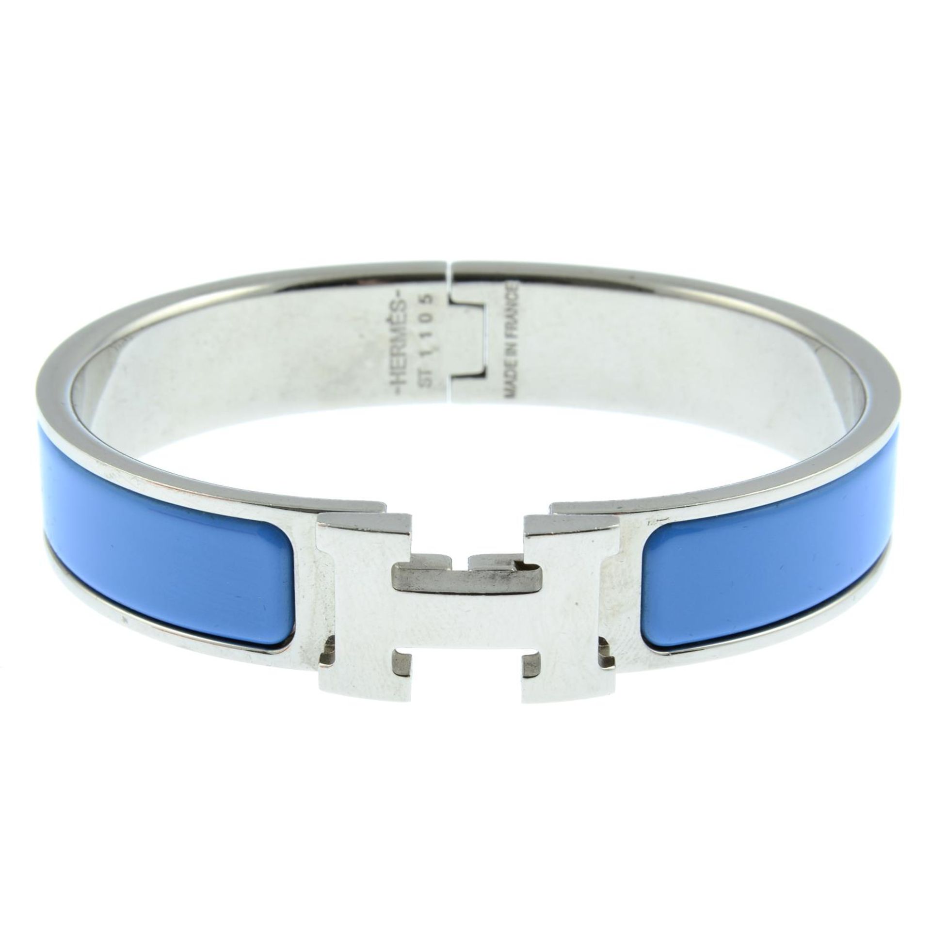 HERMÈS - a Clic H bangle.