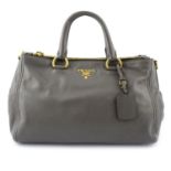 PRADA - a grey leather handbag.