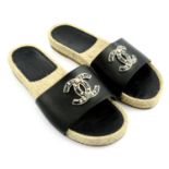 CHANEL - a pair of leather espadrille slide sandals.