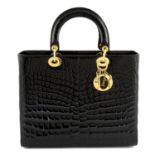 CHRISTIAN DIOR - a black crocodile Lady Dior handbag.