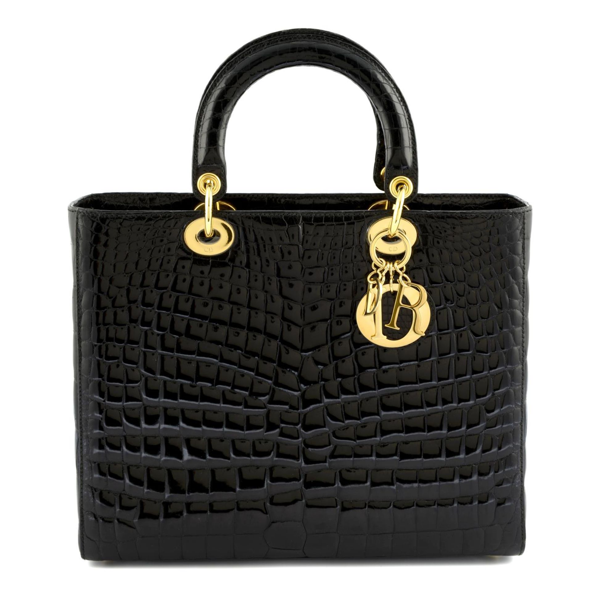 CHRISTIAN DIOR - a black crocodile Lady Dior handbag.