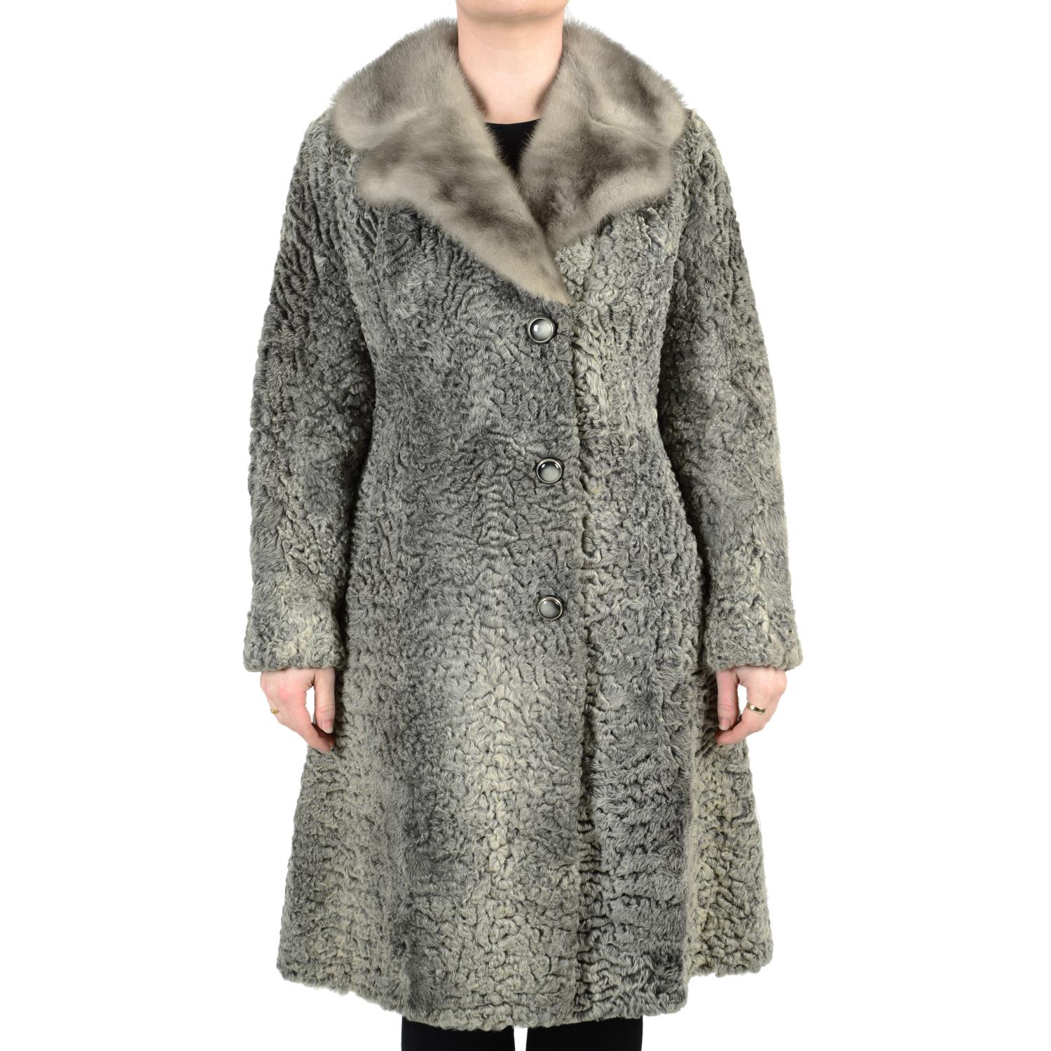 A three-quarter length karakul grey coat with sapphire mink collar and karakul hat.