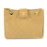 CHANEL - a vintage beige quilted handbag.