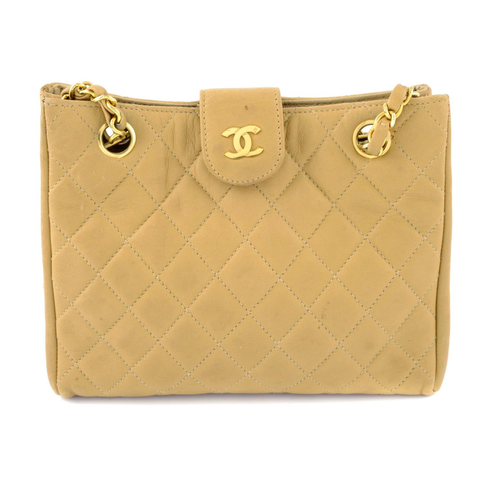 CHANEL - a vintage beige quilted handbag.