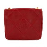 CHANEL - a red leather flap crossbody handbag.