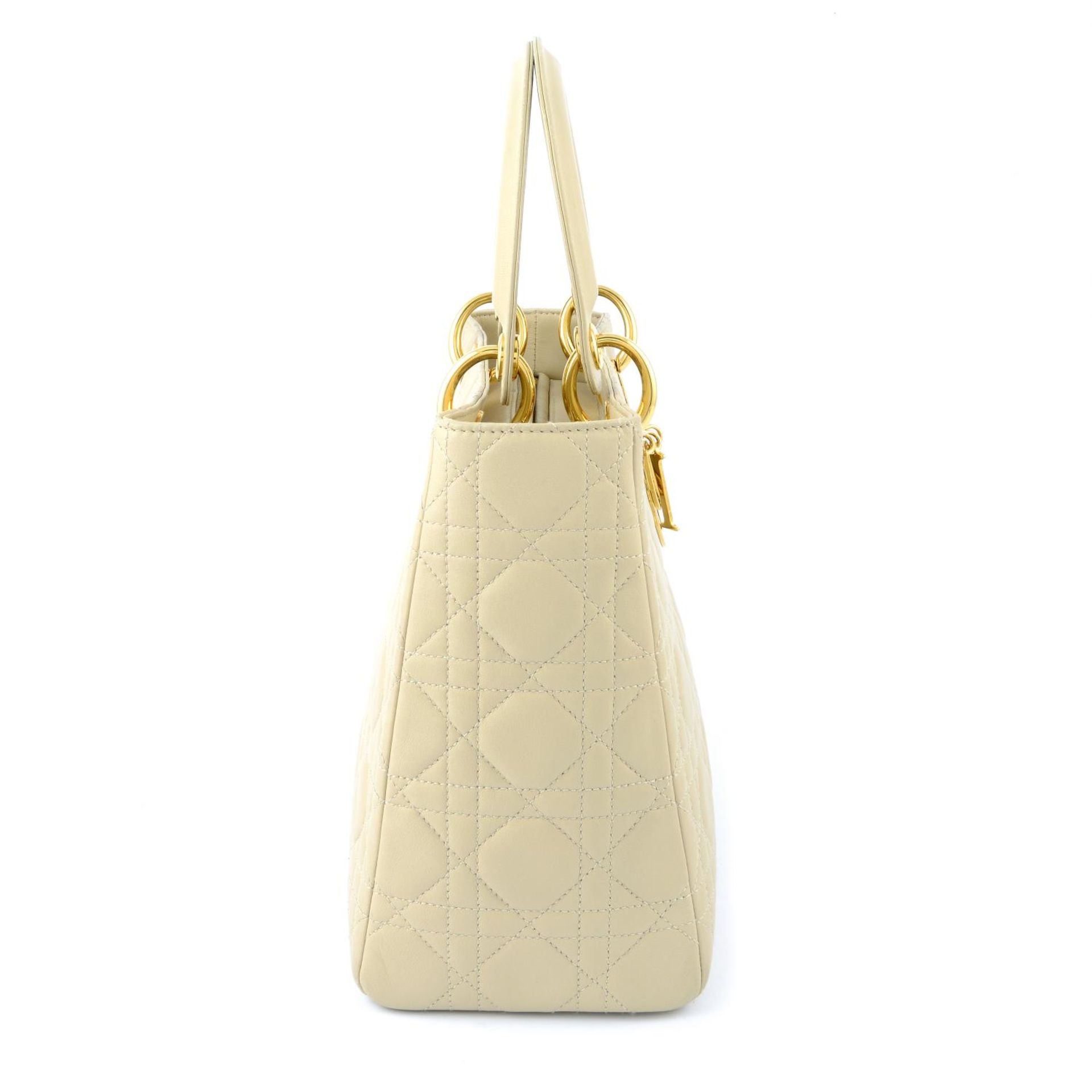 CHRISTIAN DIOR - a beige cannage leather Lady Dior handbag. - Image 3 of 5